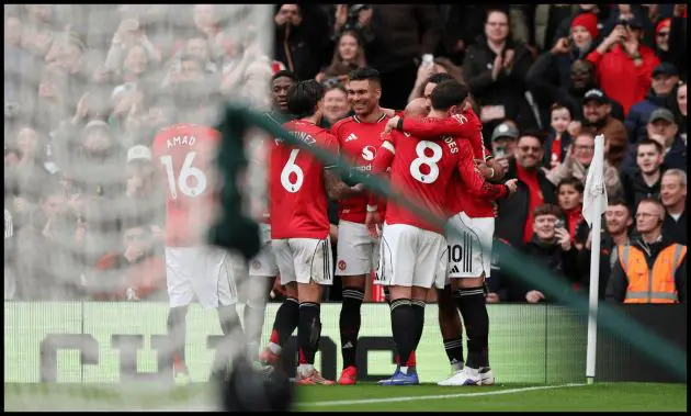 Casemiro celebrates with his teammates after scoring for Man United vs Fulham.