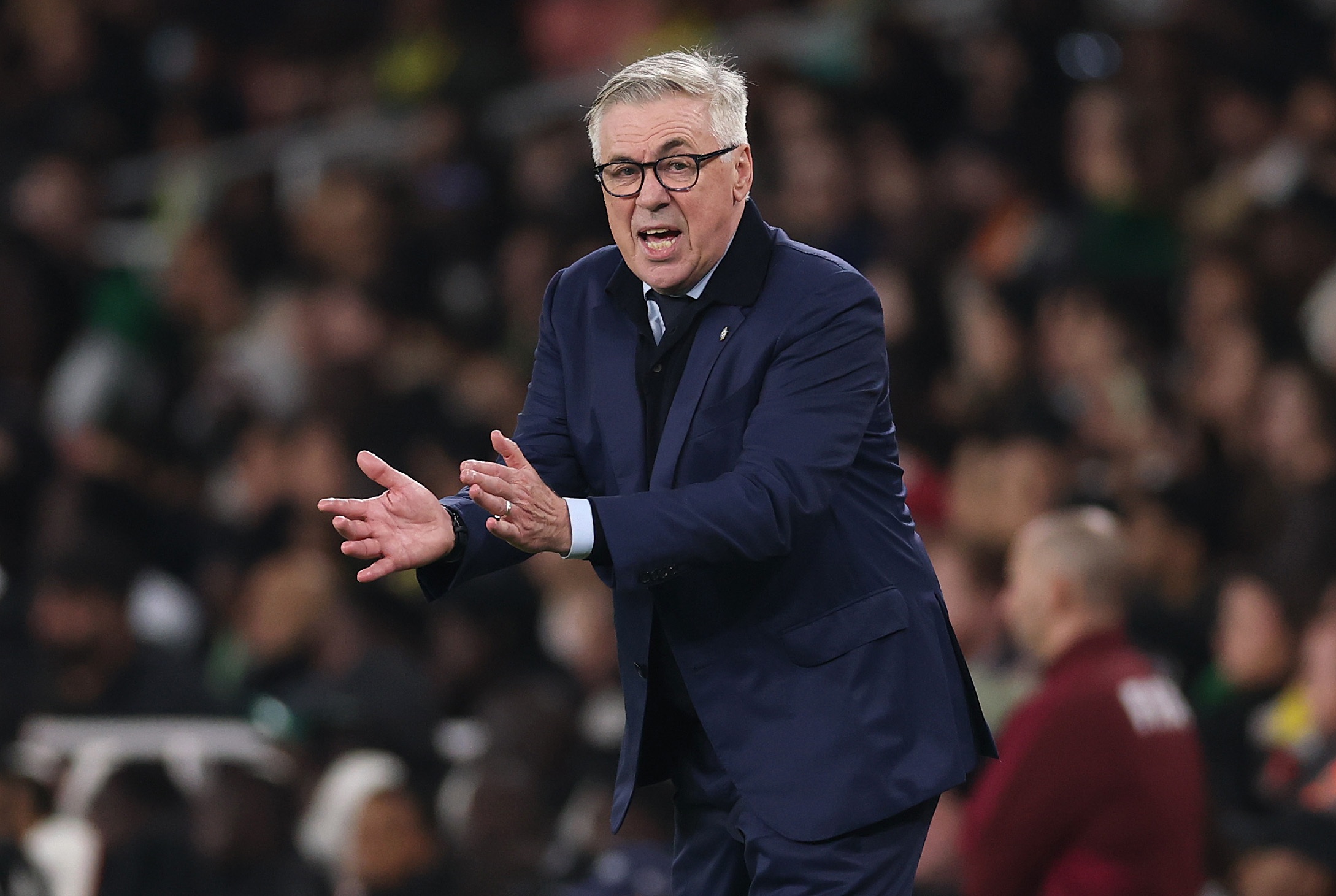Carlo Ancelotti gestures with his hands during Brazil game.