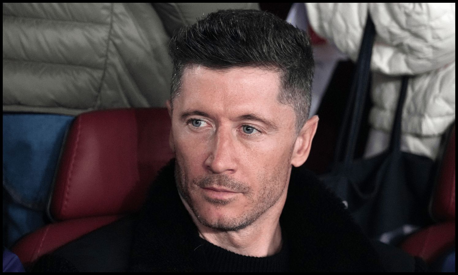 Robert Lewandowski looks on from the bench.