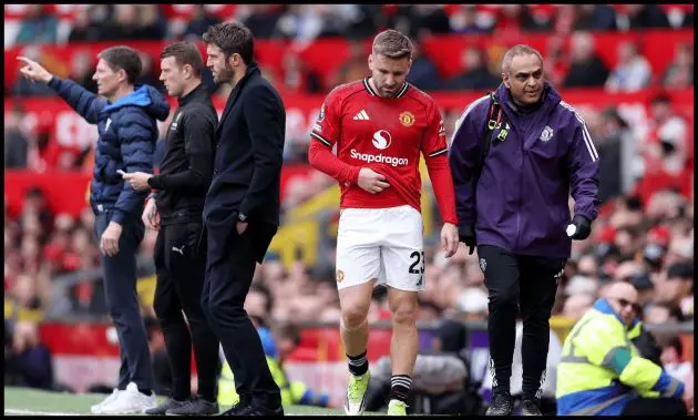 Luke Shaw looks dejected after being subbed off with an injury.