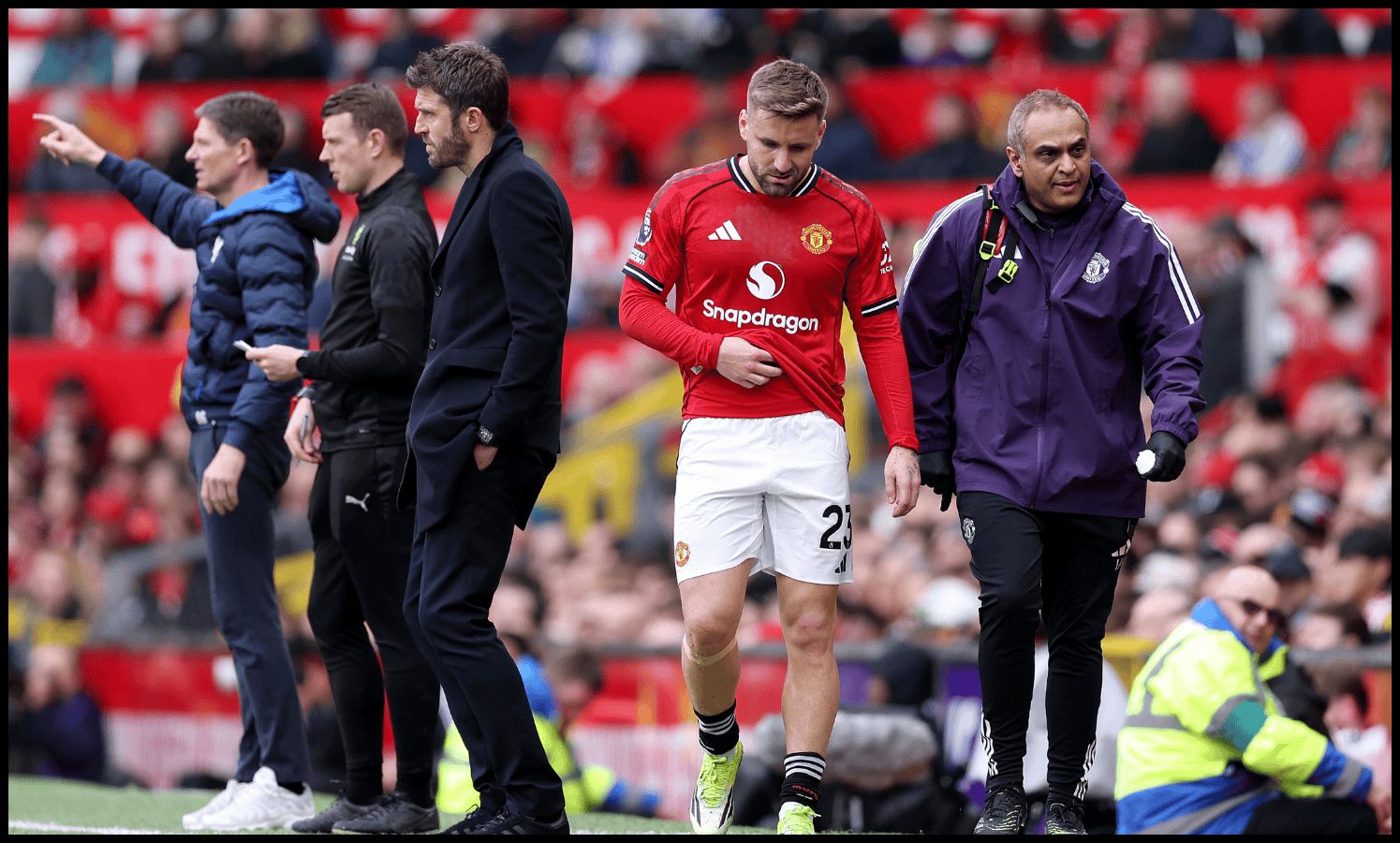 Luke Shaw looks dejected after being subbed off with an injury.
