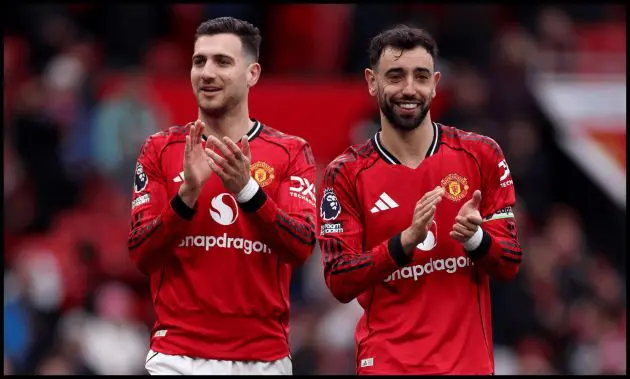 MANCHESTER, ENGLAND - MARCH 15: Diogo Dalot and Bruno Fernandes of Manchester United acknowledge the fans after the Premier League match between Manchester United and Aston Villa at Old Trafford on March 15, 2026 in Manchester, England.