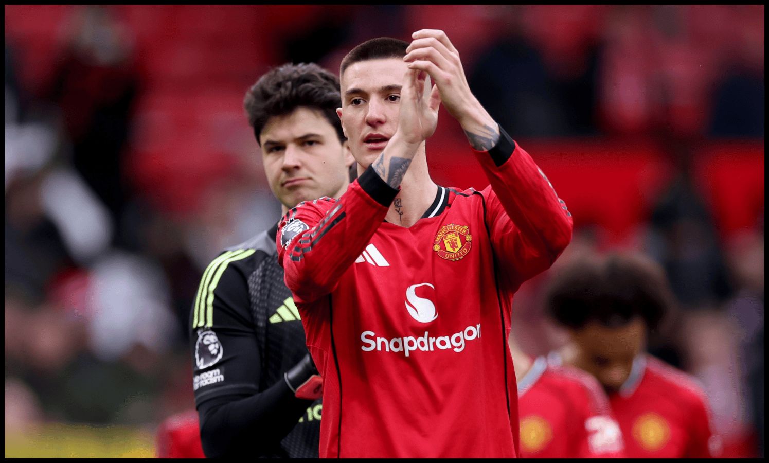 Benjamin Sesko applauds the Man United fans at Old Trafford.