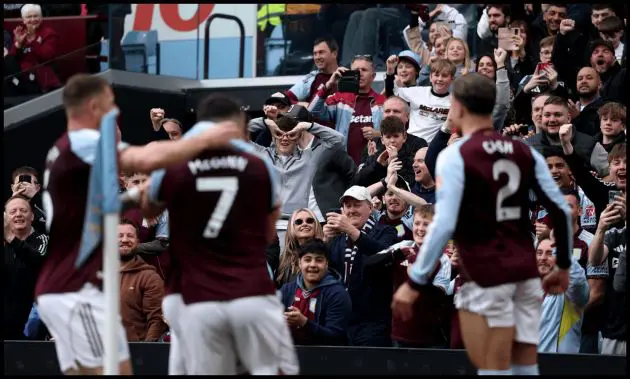 BIRMINGHAM, ENGLAND - MARCH 22: Aston Villa fans celebrate their teams first goal scored by John McGinn of Aston Villa during the Premier League match between Aston Villa and West Ham United at Villa Park on March 22, 2026 in Birmingham, England.