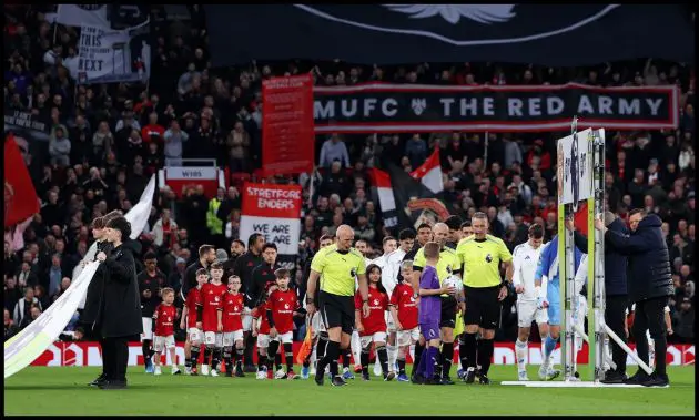 MANCHESTER, ENGLAND - APRIL 13: General view inside the stadium as players of both side's line up prior to the Premier League match between Manchester United and Leeds United at Old Trafford on April 13, 2026 in Manchester, England.