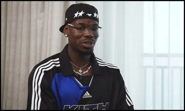 Paul Pogba talks to Rio Ferdinand.