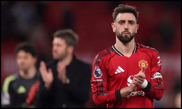 MANCHESTER, ENGLAND - APRIL 13: Bruno Fernandes of Manchester United looks dejected as he applauds the fans after the team's defeat in the Premier League match between Manchester United and Leeds United at Old Trafford on April 13, 2026 in Manchester, England.
