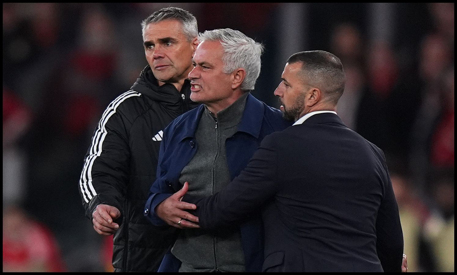 Jose Mourinho being held down