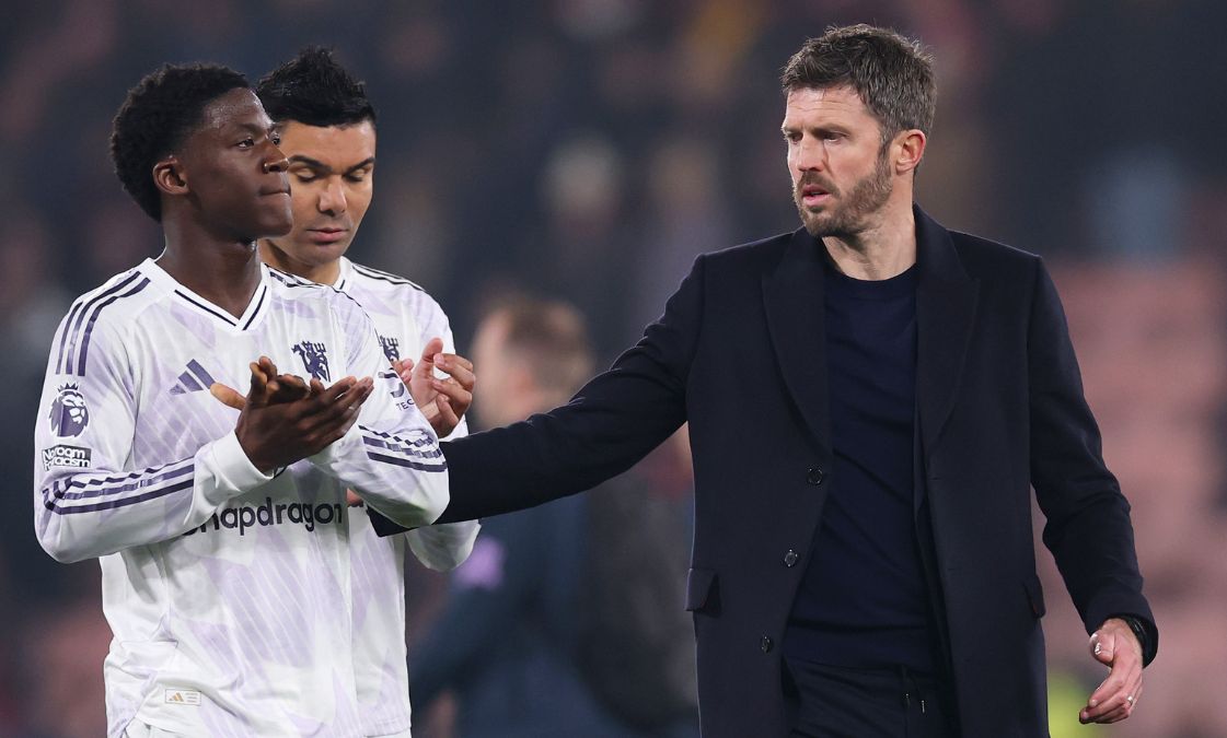 Man Utd manager Michael Carrick with Kobbie Mainoo