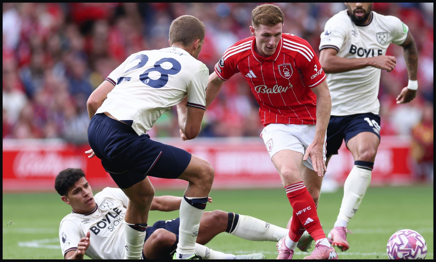 NOTTINGHAM, ENGLAND - AUGUST 31: Elliot Anderson of Nottingham Forest battles for the ball with Tomas Soucek, Mateus Fernandes and Lucas Paqueta of West Ham during the Premier League match between Nottingham Forest and West Ham United at City Ground on August 31, 2025 in Nottingham, England.