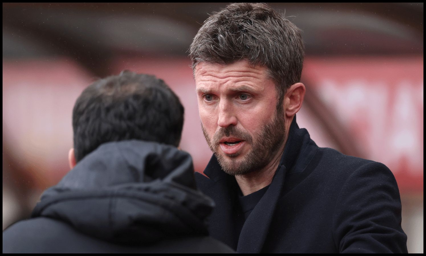 SUNDERLAND, ENGLAND - MAY 09: Michael Carrick, Manager of Manchester United, interacts with Regis Le Bris, Manager of Sunderland, prior to the Premier League match between Sunderland and Manchester United at Stadium of Light on May 09, 2026 in Sunderland, England.