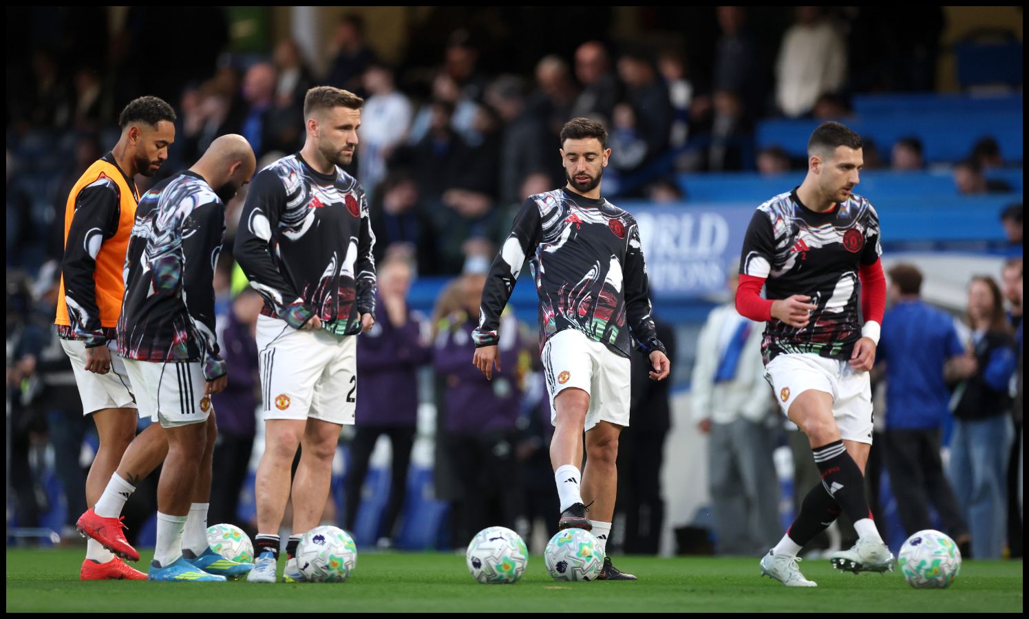 Bruno Fernandes and Luke Shaw warming up