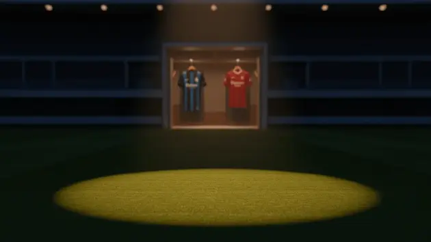 Empty football pitch midfield with competing team jerseys symbolizing transfer battle