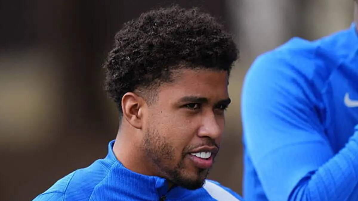 Andrey Santos in Chelsea training gear, smiling during a session.