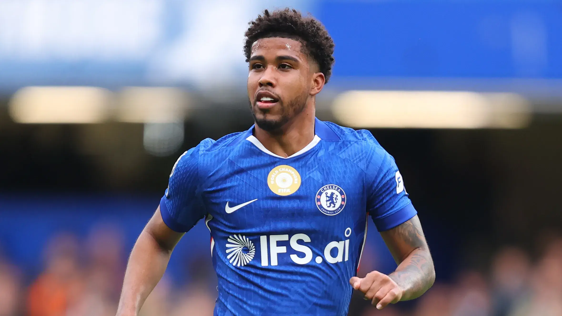 Andrey Santos in a blue Chelsea FC kit during a football match.