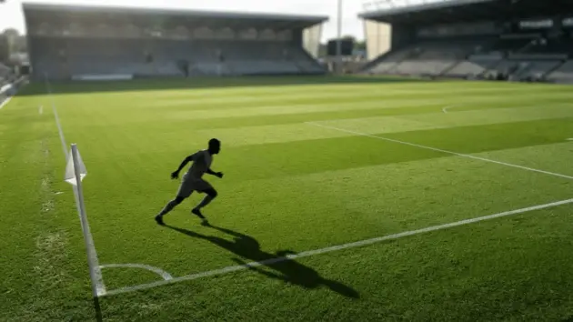 Football pitch left-back defensive position with player silhouette on Premier League stadium turf