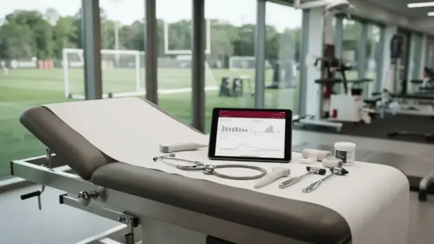 Medical examination room at football training facility with professional sports medicine equipment
