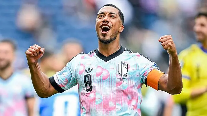 Youri Tielemans celebrating in a Belgium national team jersey.