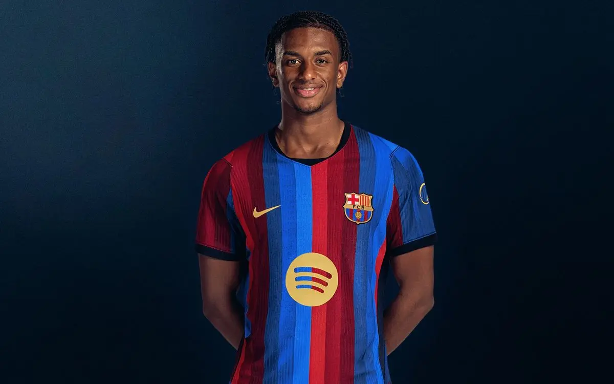 Portrait of Alejandro Balde wearing a blue and red striped FC Barcelona jersey against a dark blue background.