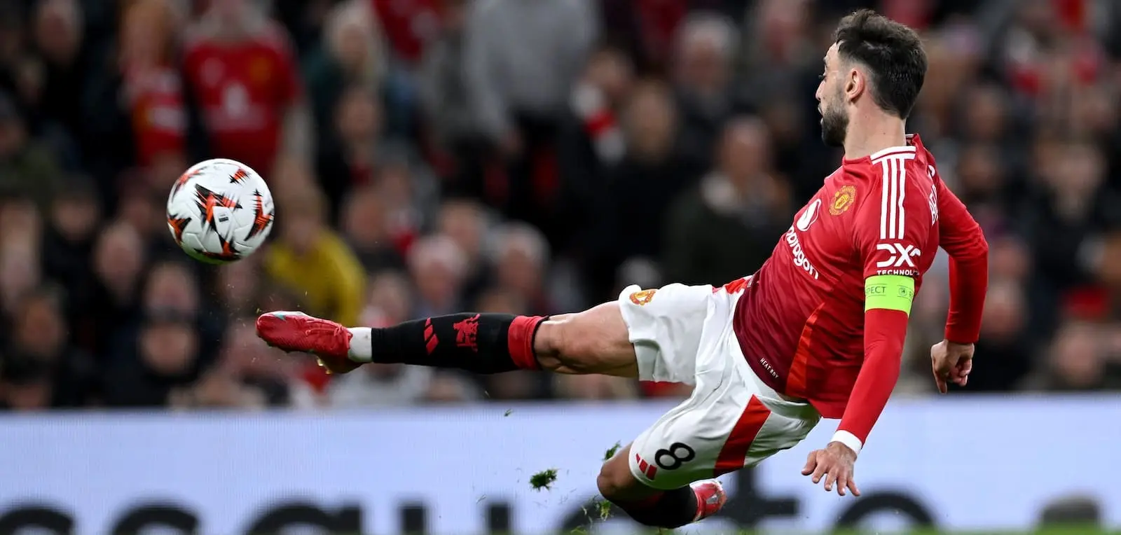 Bruno Fernandes of Manchester United kicking a football during a match.
