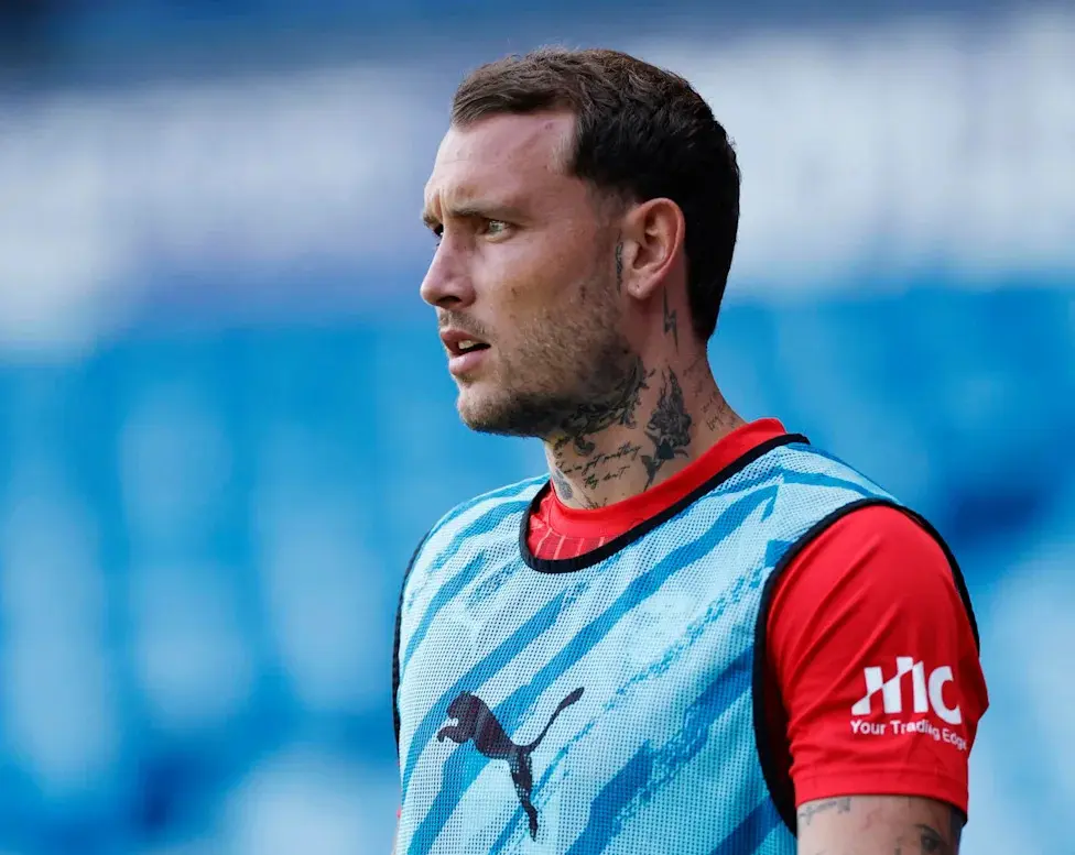 Close-up profile shot of David Raum in an RB Leipzig training bib.