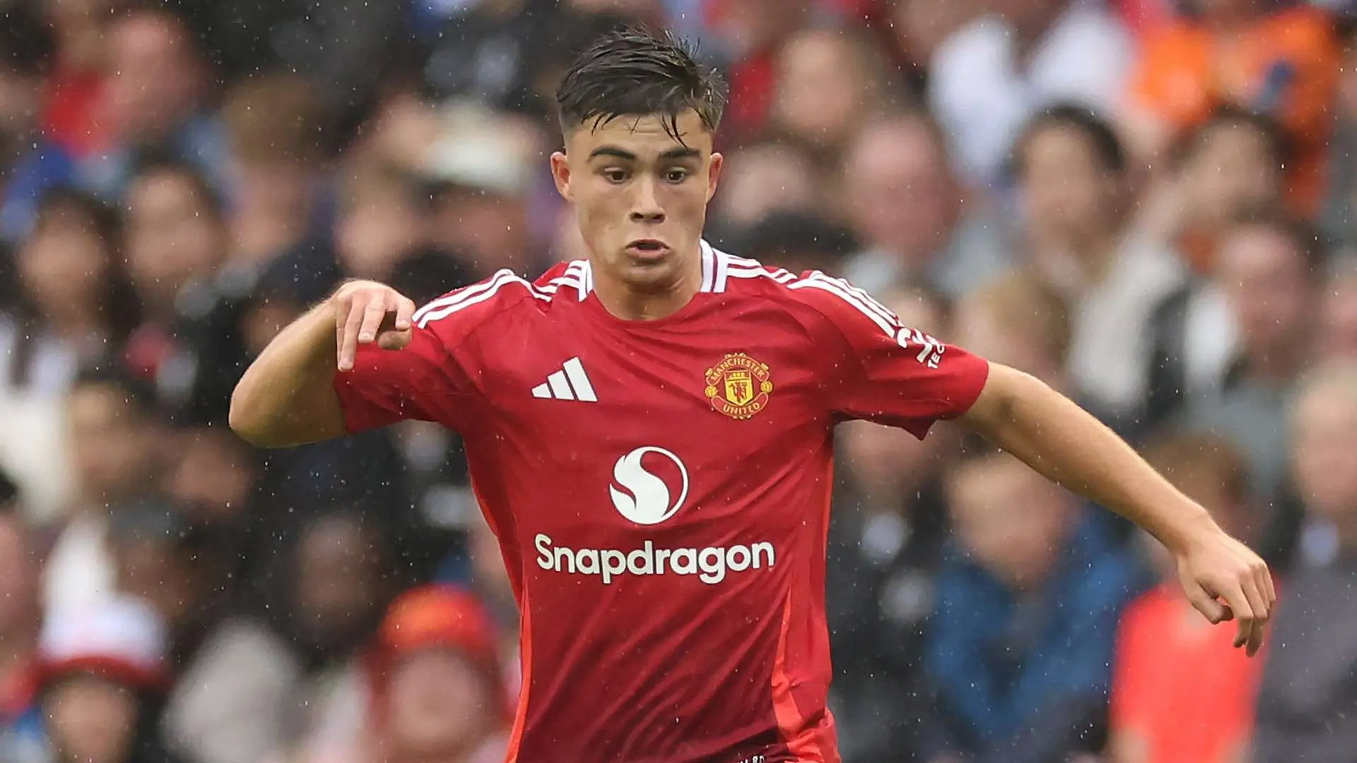 Harry Amass in a red Manchester United home kit during a match