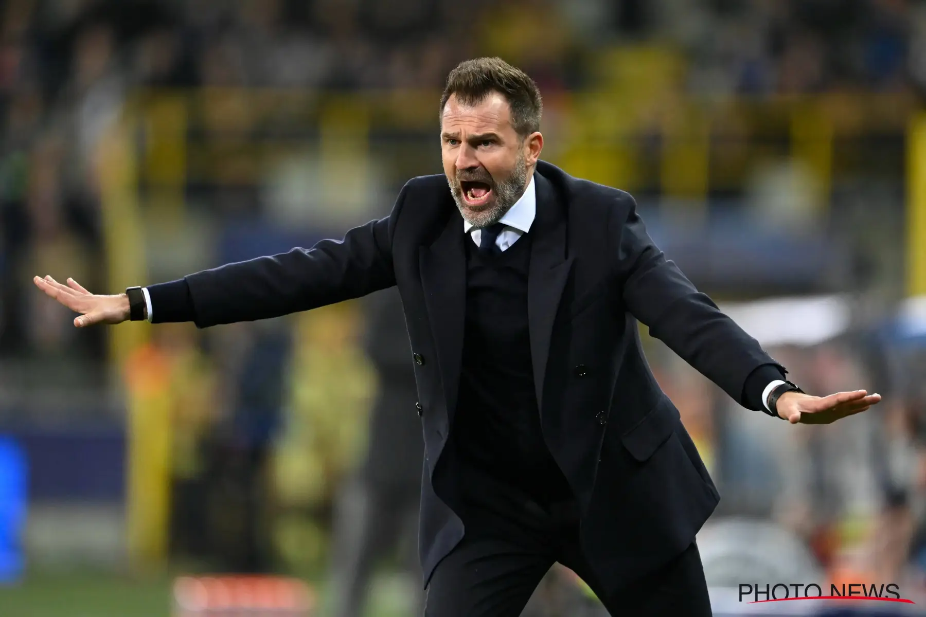 Ivan Leko shouting with arms outstretched during a match as coach of Club Brugge