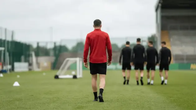 Manchester United footballer returns to training as teammates gather on a Dublin pitch