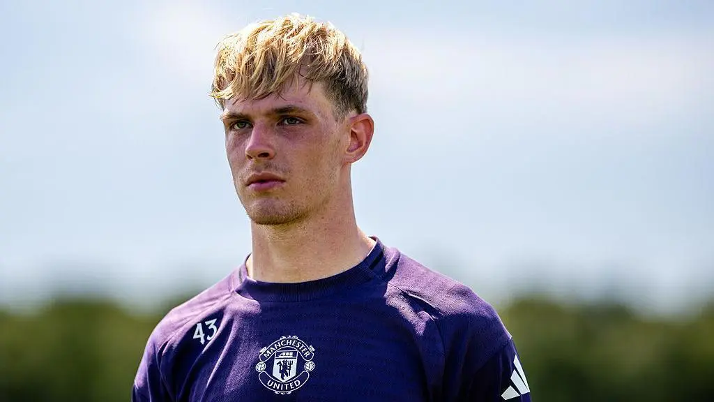 Toby Collyer wearing a purple Manchester United training kit with the number 43.