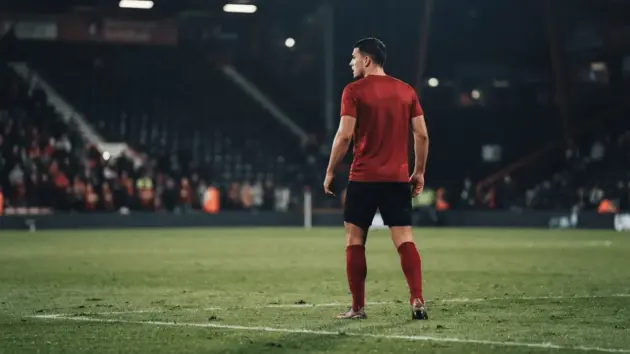 Defensive midfielder under floodlights representing Manchester United's reported interest in Tyler Adams