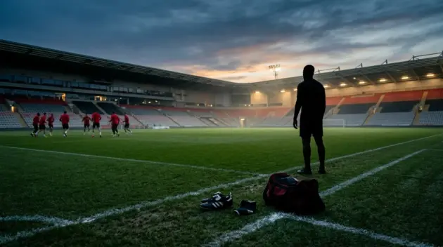 Empty football training ground symbolising Carlos Baleba's delayed Manchester United debut after an ankle injury