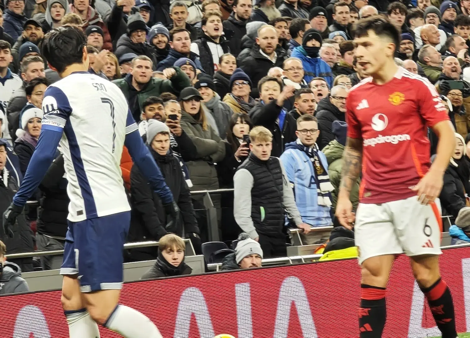 Manchester United defender Lisandro Martínez in a red home kit during a match.
